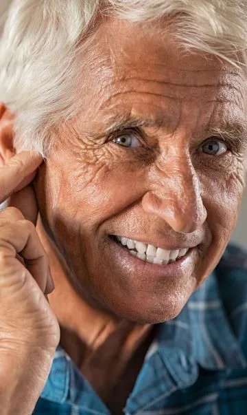 happy-man-at-home-with-hearing-aid.jpg