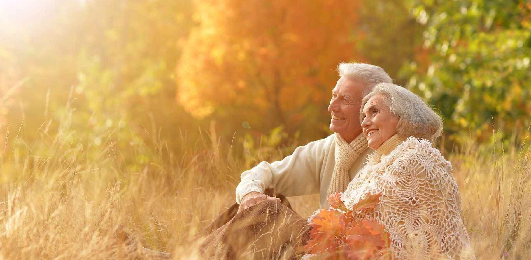 elderly-seniors-couple-sitting-nature.jpg