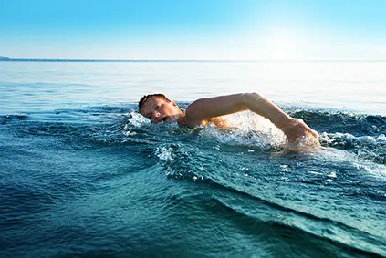 young-man-swimming-in-oceans-283 .jpg