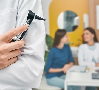 audiologist-with-otoscope-over-332.jpg