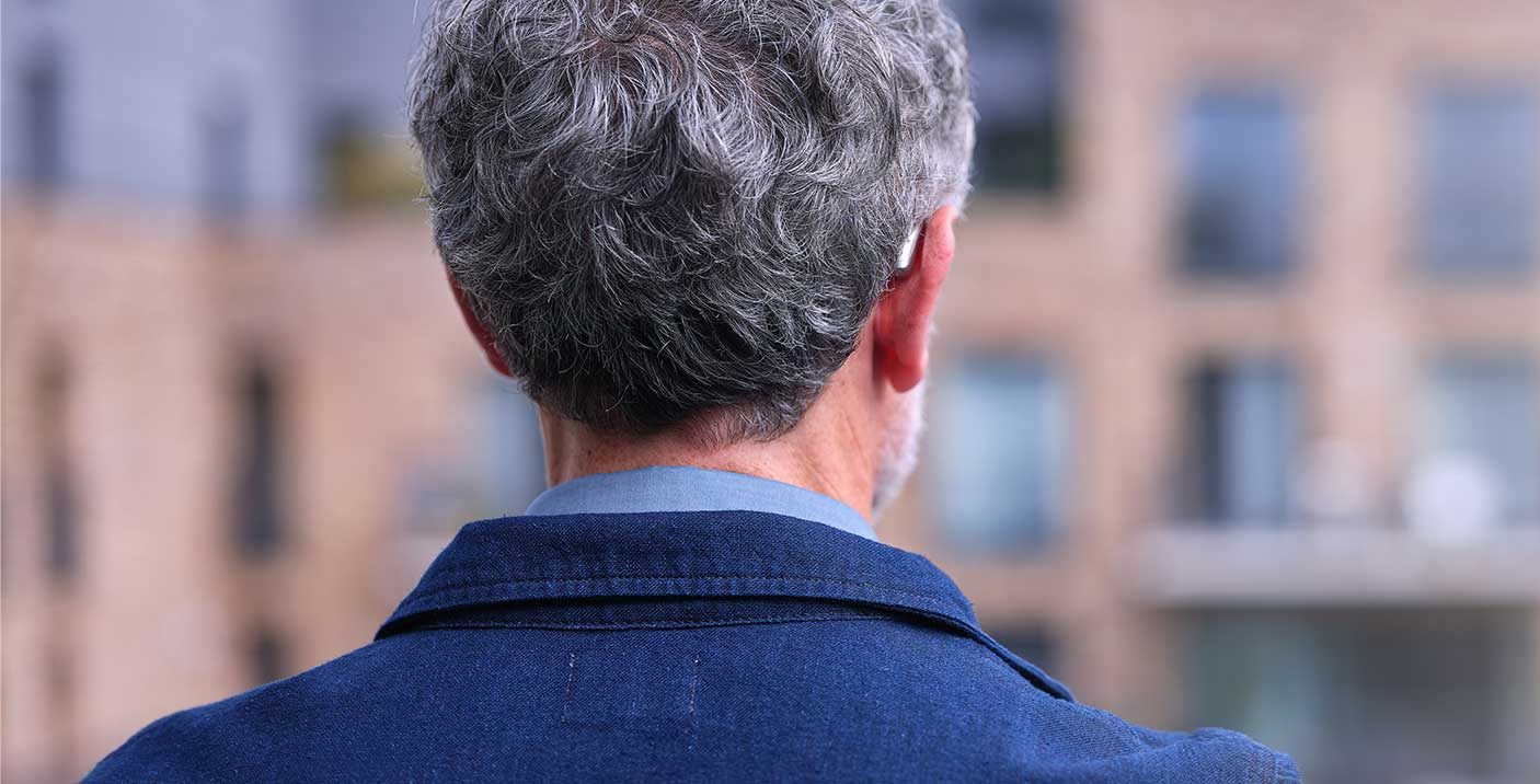 eon-man-from-back-hearing-aid-focus-discreet-flipped.png