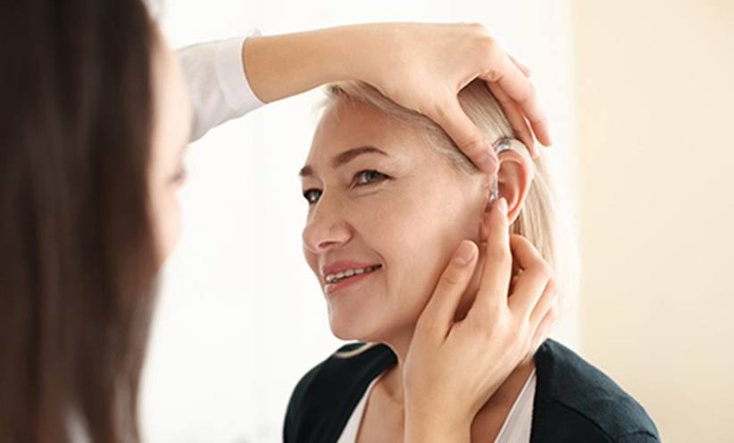 doctor-put-hearing-aid-to-woman-ear-500.jpg