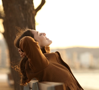 woman-enjoy-sun-on-banch-332x300.jpg