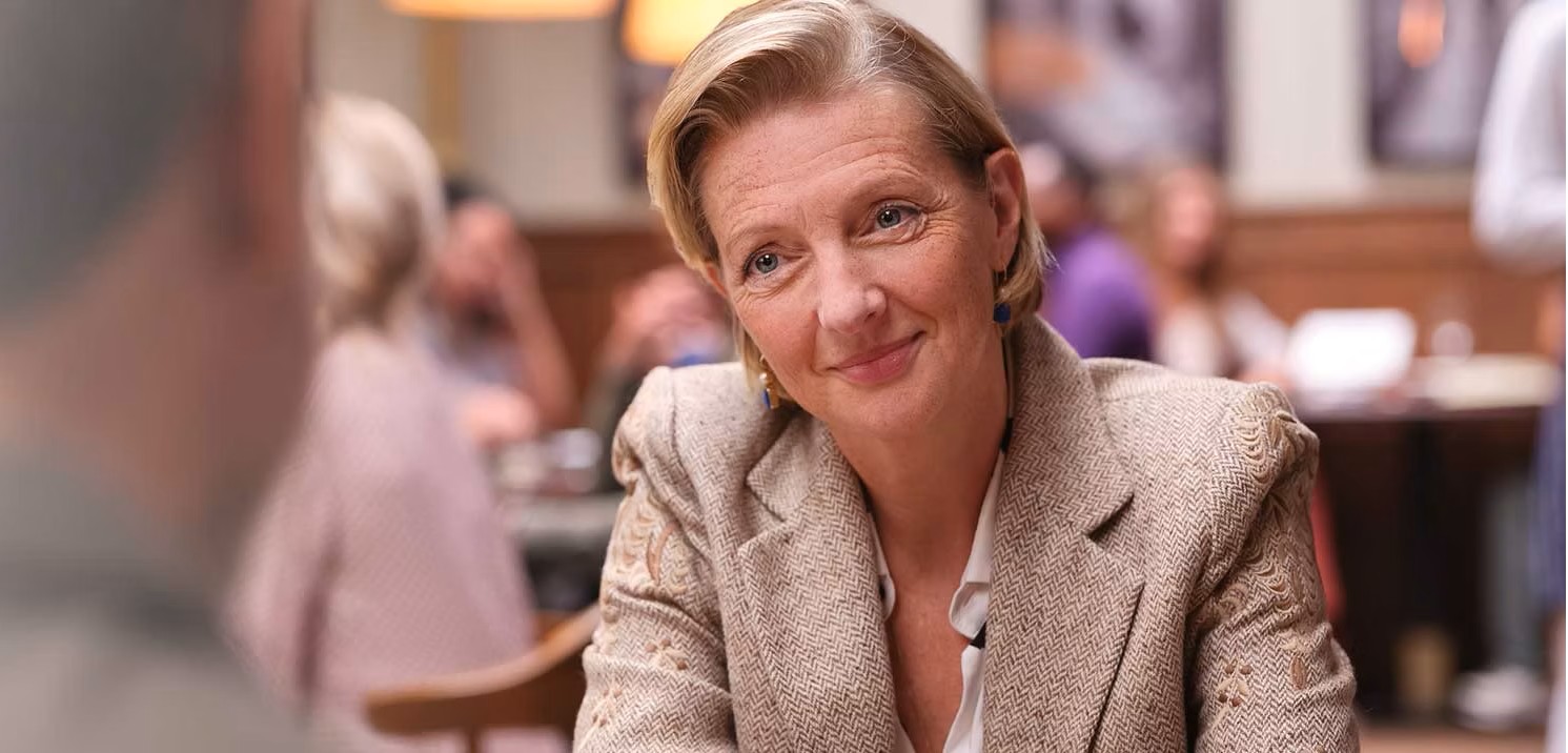 eon-banner-woman-sitting-restaurant-table.jpg