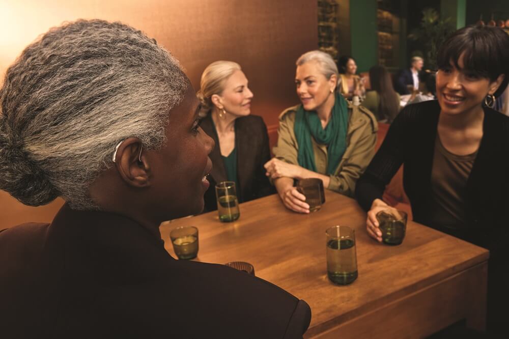 women-wearing-hearing-aids-in-restaurant.jpg