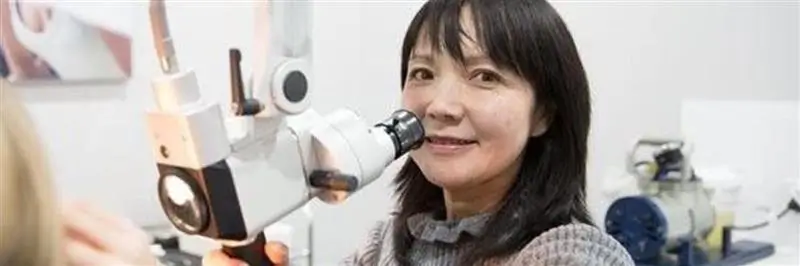 Audiologist-checking-ear.webp