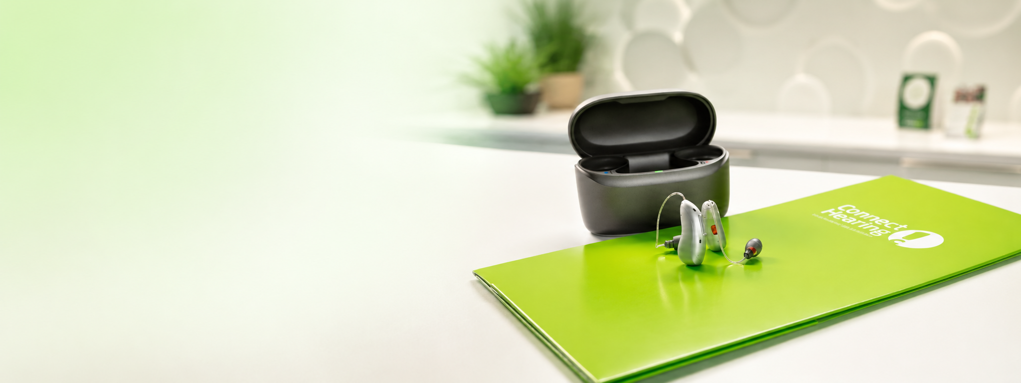 Modern Hearing Aids on Green Brochure.png