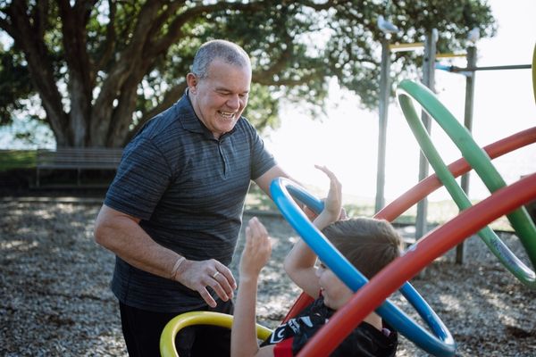 man with hearing aids at the playground.jpg