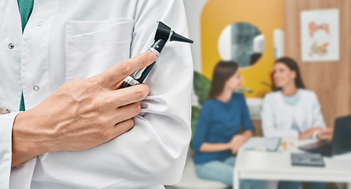 audiologist-with-otoscope-over-500.jpg