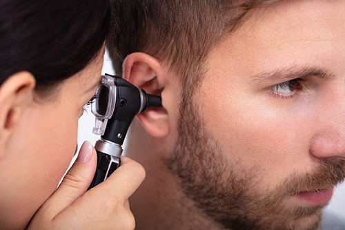 doctor-examining-male-patient-500.jpg