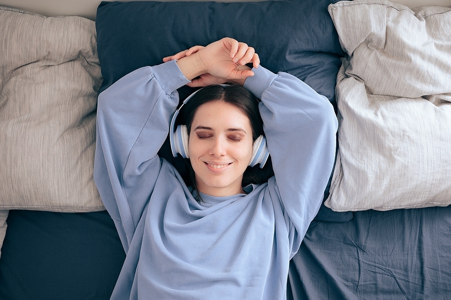 bigstock-relaxed-woman-wearing-headphon-413922767.jpg