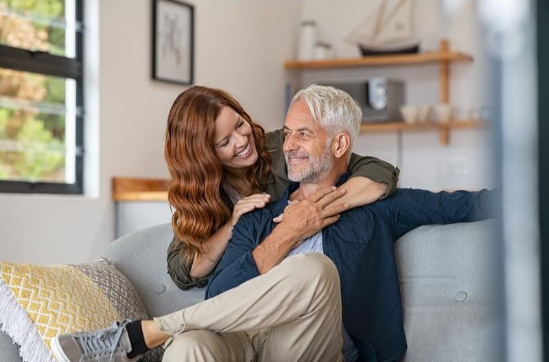 smiling-woman-hugging-her-husband.jpg