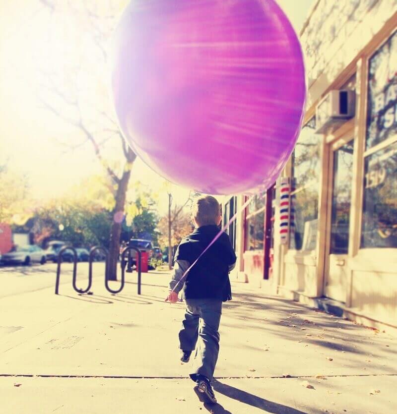 little-boy-running-with-a-balloon.jpg
