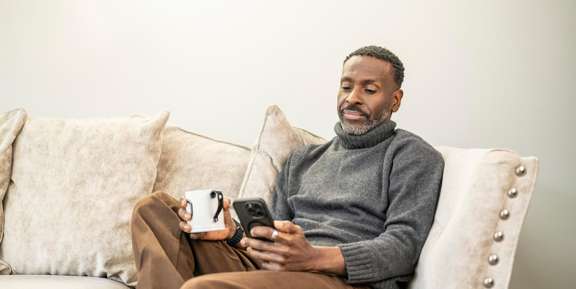 man-sitting-on-sofa-desktop-banner.jpg