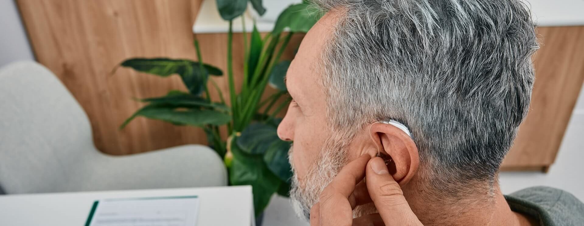 audiologist-fits-a-hearing-aid-desktop-banner.jpg