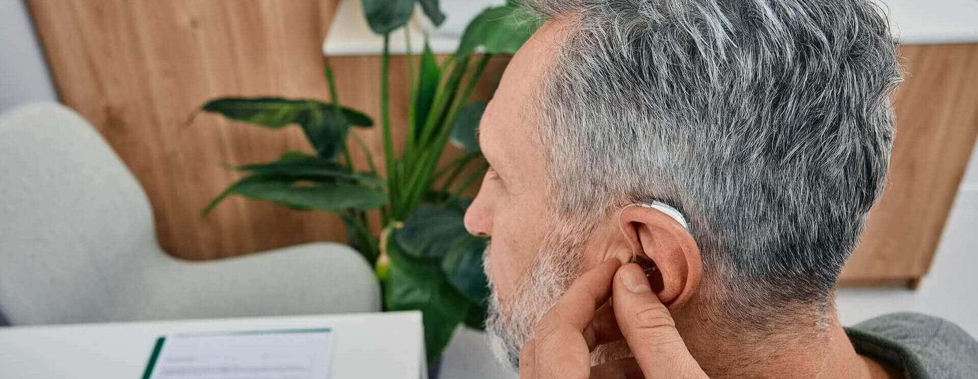 audiologist-fits-a-hearing-aid-desktop-banner.jpg