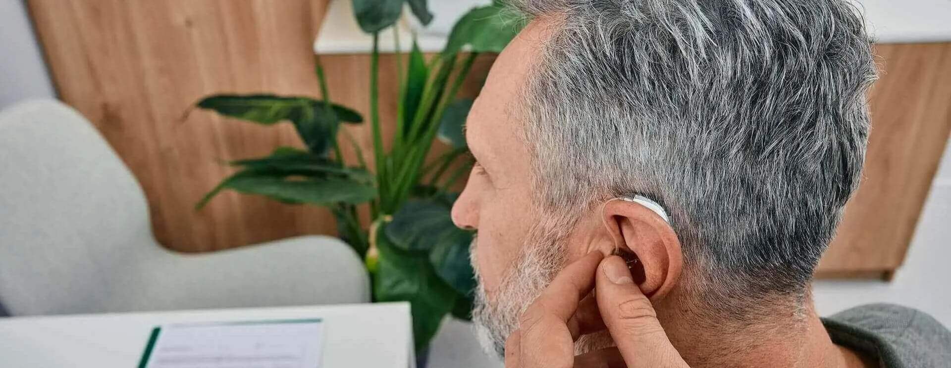 audiologist-fits-a-hearing-aid-desktop-banner.jpg