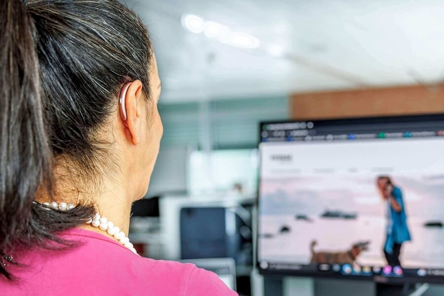 women-wearing-hearing-aid-while-working.jpg