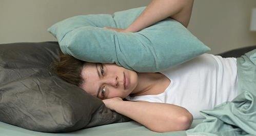 bigstock-a-young-woman-is-woken-up-in-t-404590139_500_.jpg