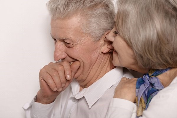 bigstock-elderly-couple-whispering-61610729.jpg