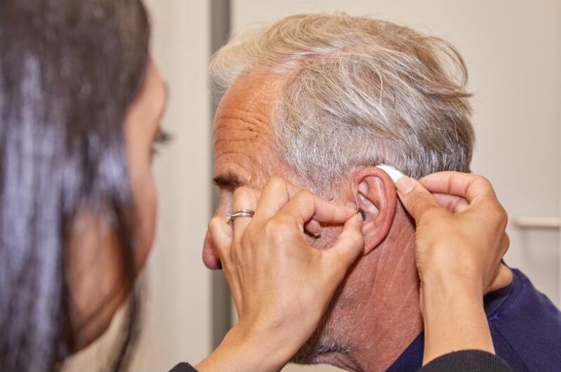 senior-having-hearing-aid-fitted.jpg