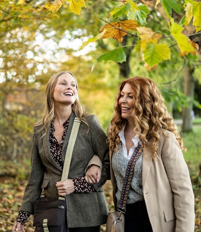 women-walking-through-woods-mobile-banner.jpg