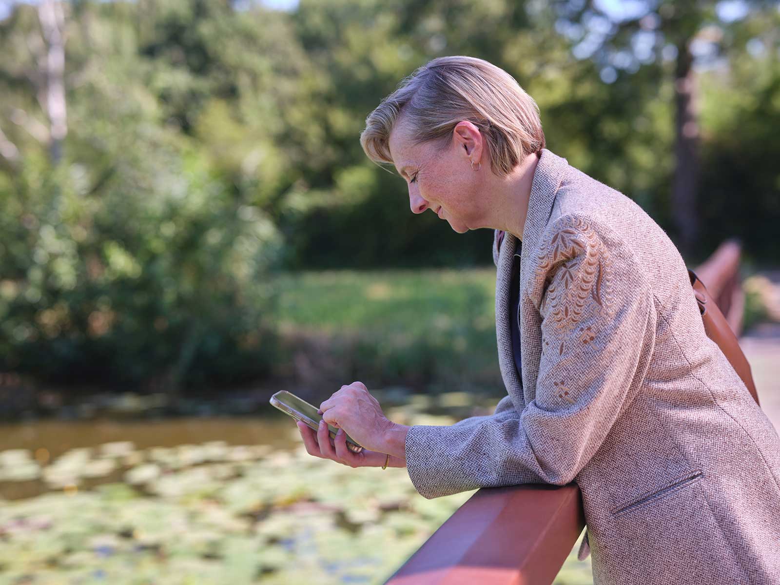 woman-standing-by-lake-phone-eon.jpg