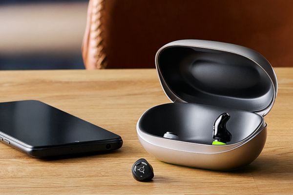 virto hearing aids on a table charging.jpg