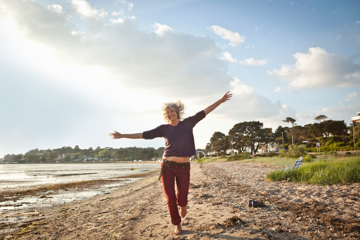 Happy women running on the beach