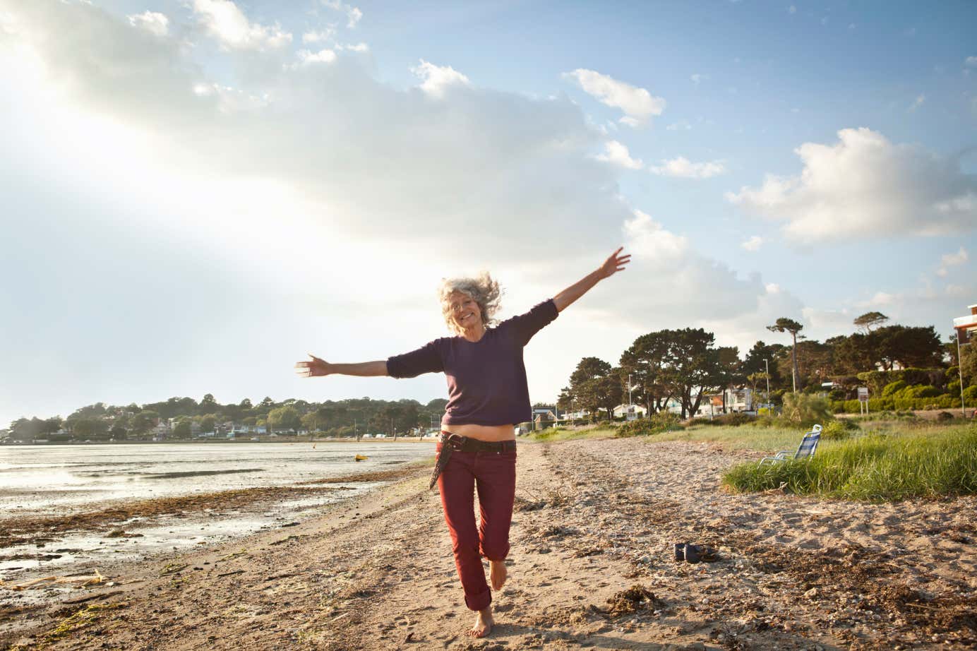 Happy women running on the beach