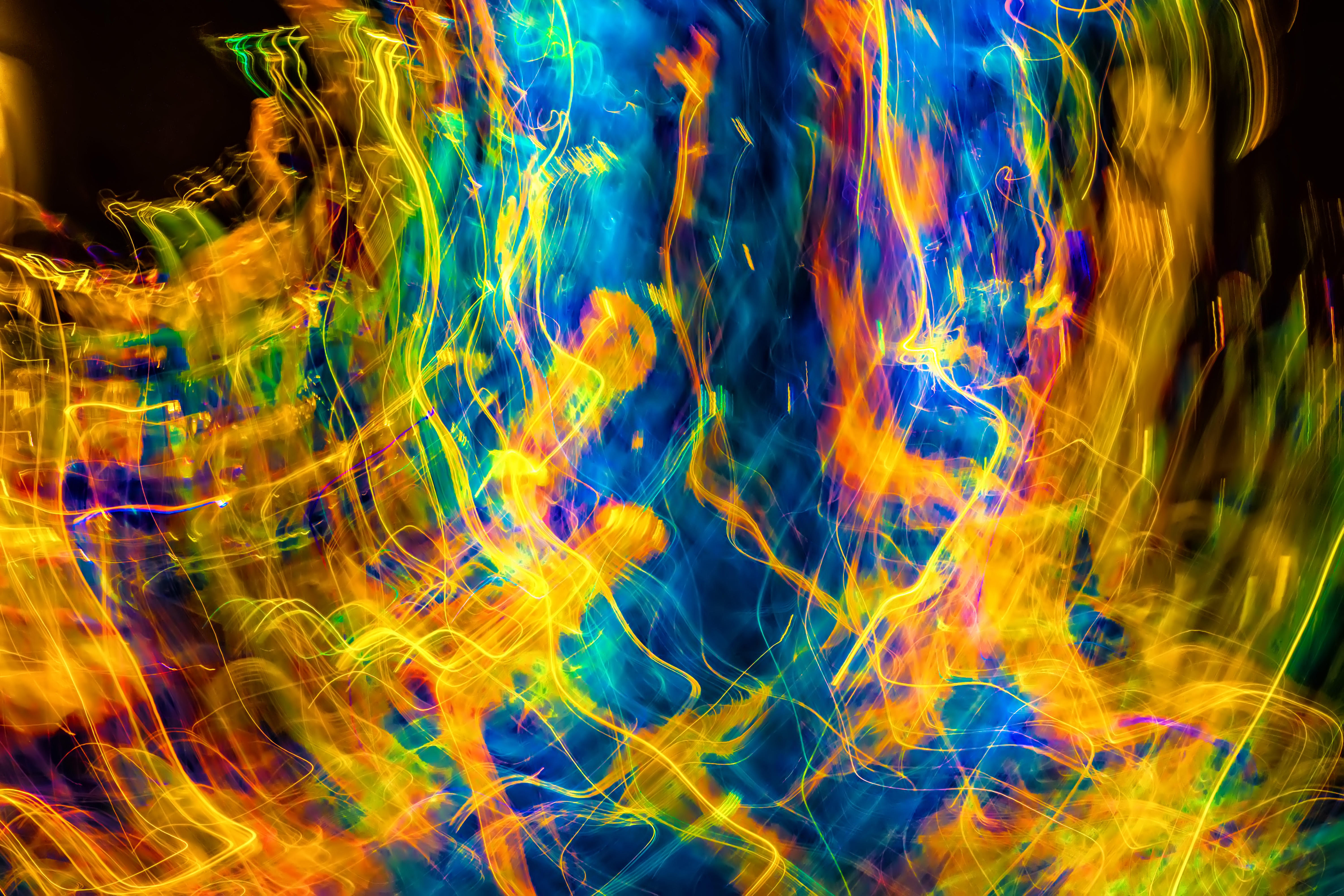 Abstract digital art with vibrant flowing colors including blues, yellows, oranges, and greens creating dynamic swirling patterns against a dark background, representing the complexity and interconnected nature of financial systems and the need for adaptive, pattern-based solutions to serve diverse user needs