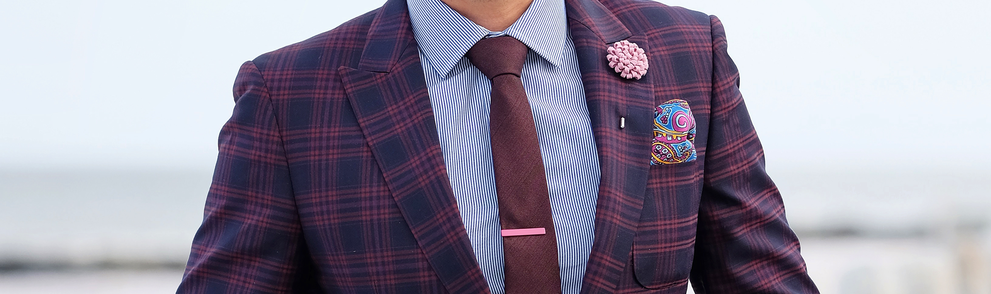 Here the smooth silk pocket square works well with the rougher wool necktie, because it provides texture contrast.