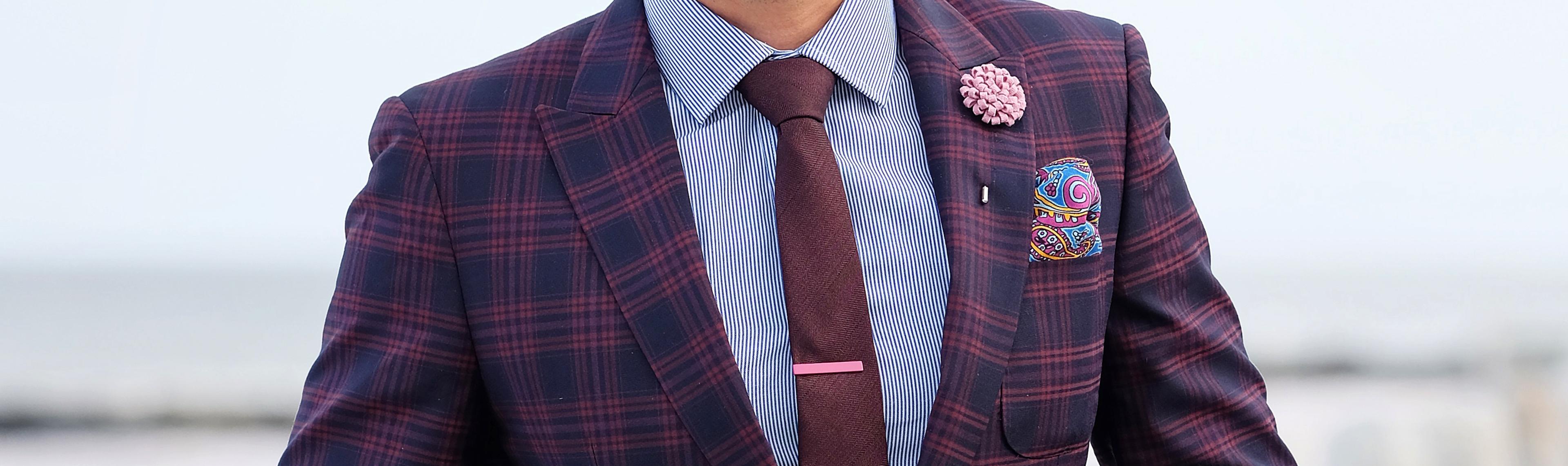 Here the smooth silk pocket square works well with the rougher wool necktie, because it provides texture contrast.
