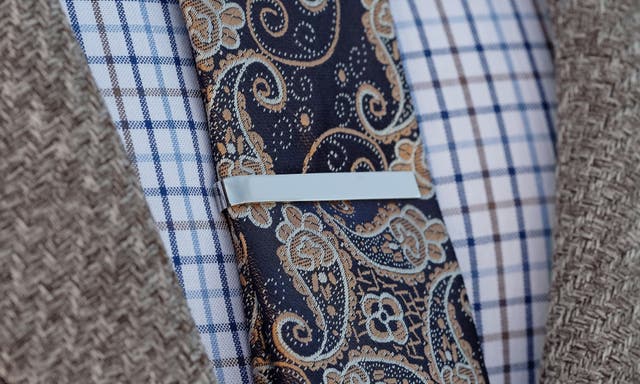 Learn everything there is to know about tie clips, tie bars, and tie accessories. From materials to wearing them correctly, and everything in between.