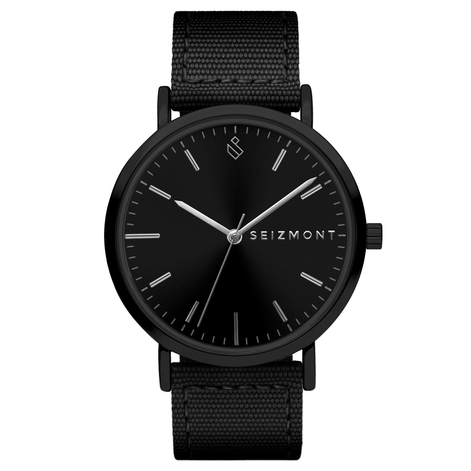 Moment | Reloj de vestir minimalista negro con movimiento de cuarzo analógico, esfera negra y correa de nailon negra Moment | Reloj de vestir minimalista negro con movimiento de cuarzo analógico, esfera negra y correa de nailon negra