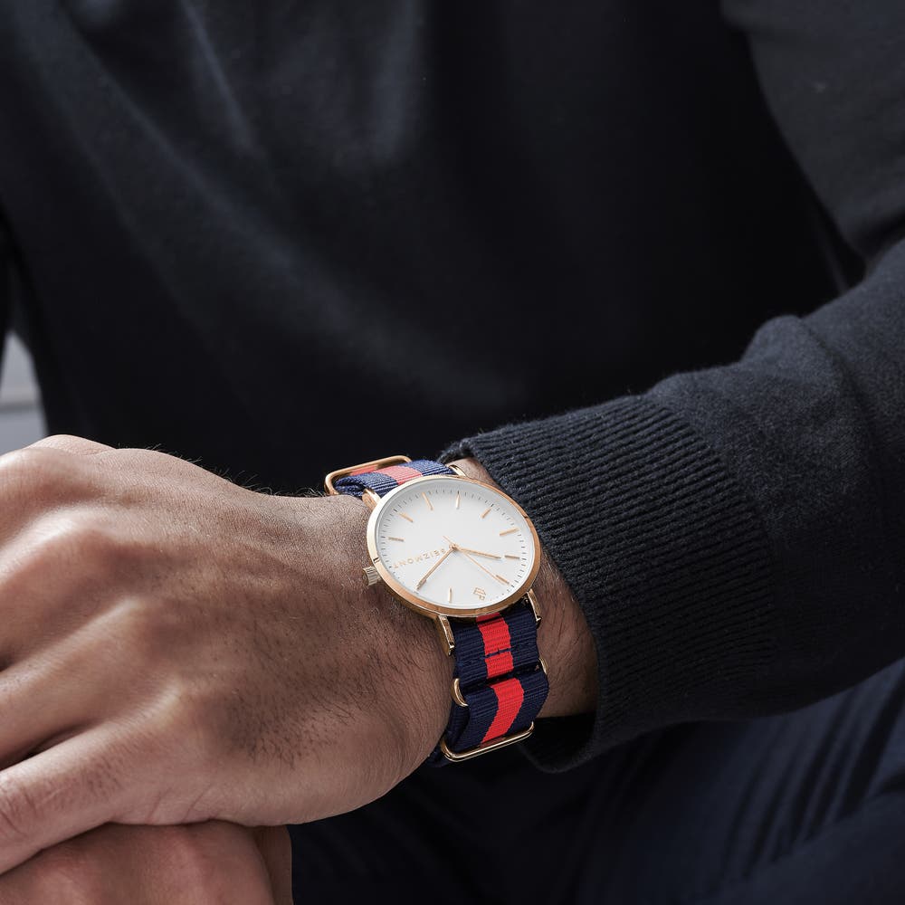hover: Moment | Rose Gold-Tone Minimalist Dress Watch With White Dial & Blue & Red Striped Nylon Strap hover: Moment | Rose Gold-Tone Minimalist Dress Watch With White Dial & Blue & Red Striped Nylon Strap