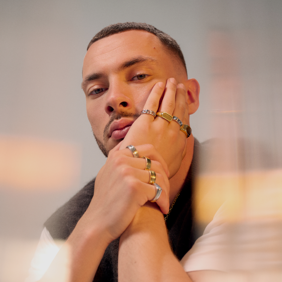 Multiple men's rings styled on one hand