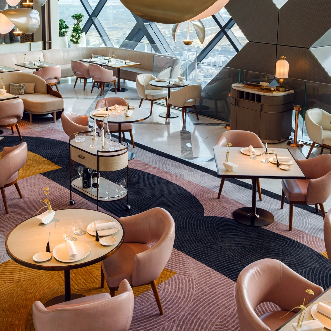 couple sits at beautiful new year's eve table at la dame de pic