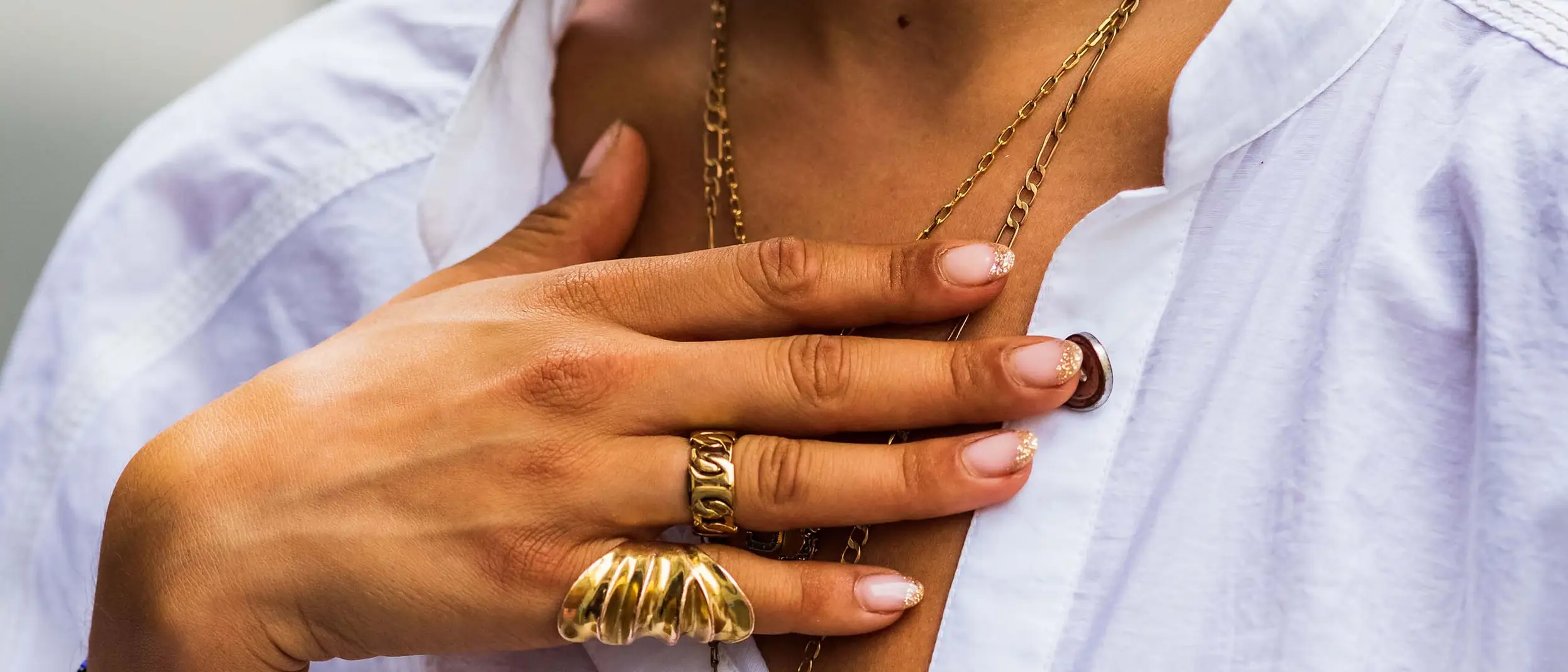 woman-with-rings-bracelets-necklaces.jpg