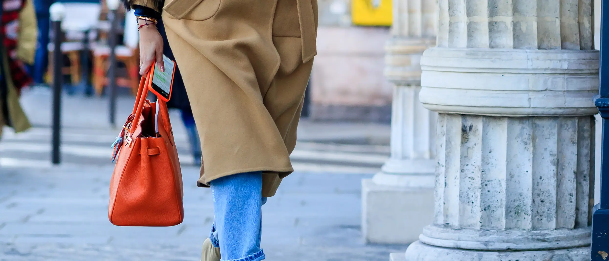 young-woman-with-orange-luxury-handbag-birkin-street-style-fashion-week.jpg