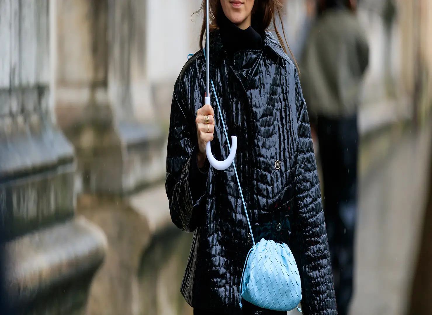 woman-in-black-under-umbrella-mini-blue-shoulder-bag-street-style-fashion-week.jpg