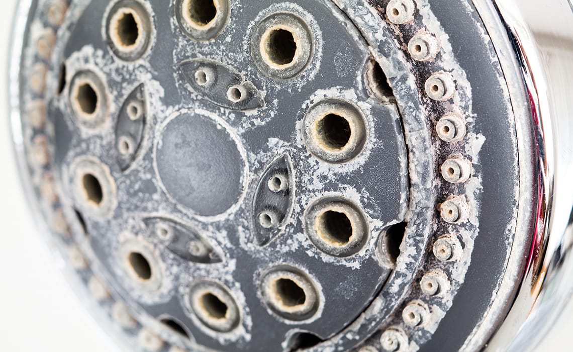 How do I remove shower limescale?