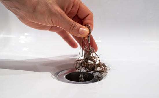 How do I unblock a shower drain?