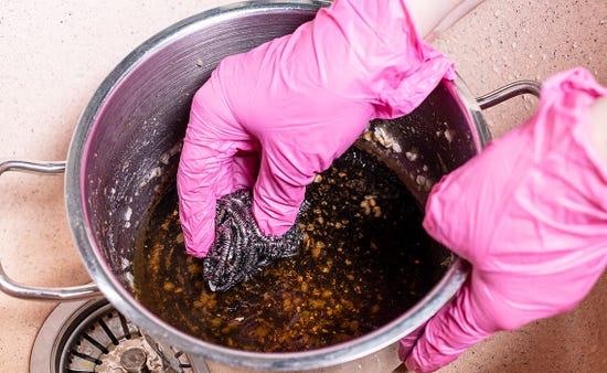 How do I clean a burnt pan or pot?