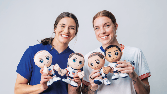 NWSLPA and U.S. soccer players, Kate Wiesner and Hal Hershfelt, with Bleacher Creatures plush from Uncanny Brands