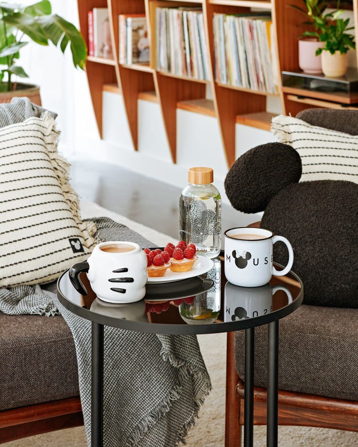 Disney cushion and mugs.