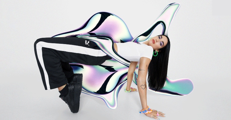 A promotional image for the 'Flutur' collection between Dua Lipa and PUMA. 