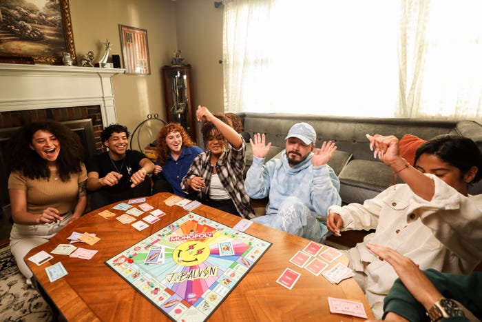 J Balvin playing Monopoly with fans.