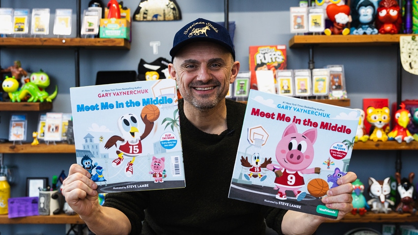 Gary Vaynerchuk with copies of "Meet Me in the Middle."