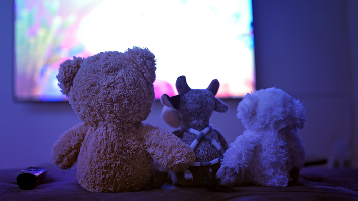 Plush toys in front of a movie, avtk, iStock / Getty Images Plus